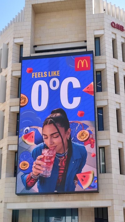 McDonald's digital OOH board in Doha reading Feels Like 0 degrees C, blue artwork with a Sprite passionfruit drink